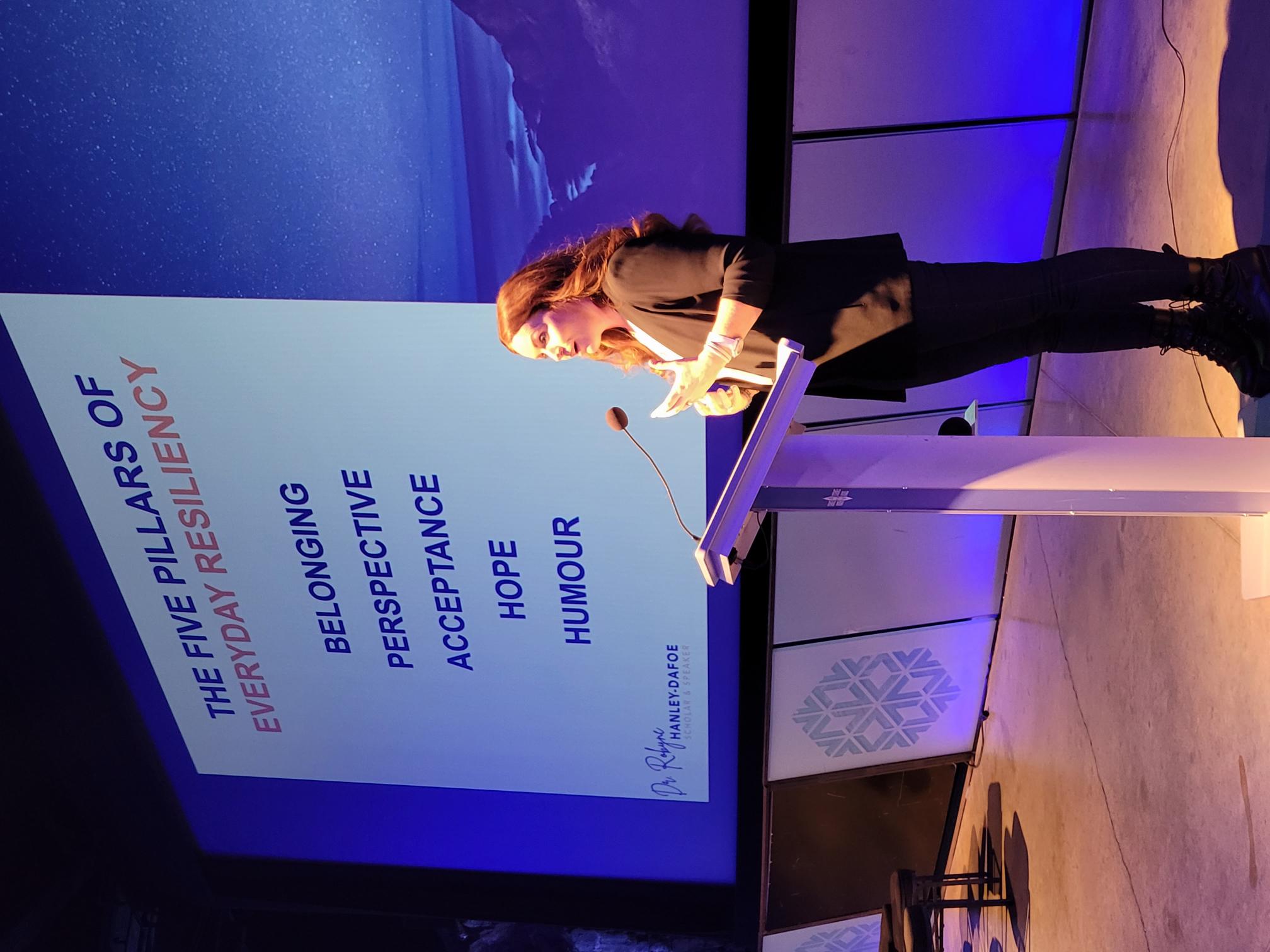 Picture of Dr. Robyne Hanley-Dafoe giving keynote address at the Gala